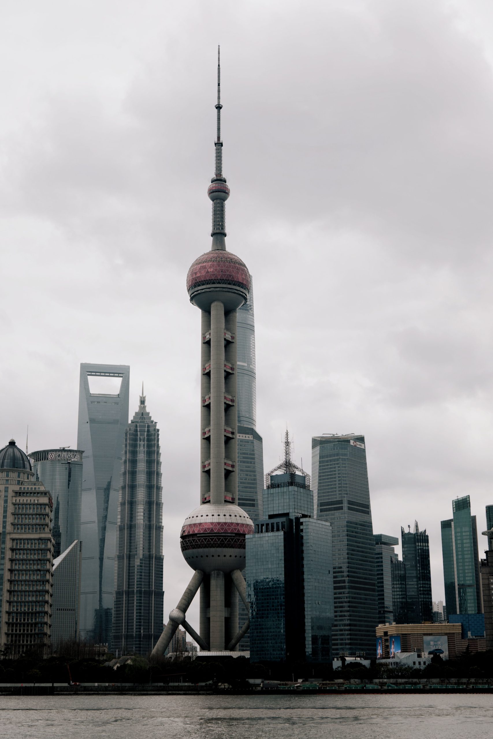 Dramatic view of Shanghai's skyline featuring the iconic Oriental Pearl Tower.